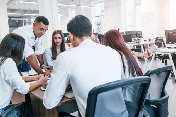 A focus group of employees discussing performance reviews
