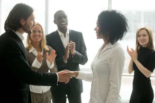 A woman getting a promotion at work