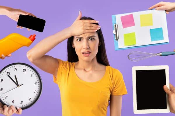 An overwhelmed worker struggling with managing tasks