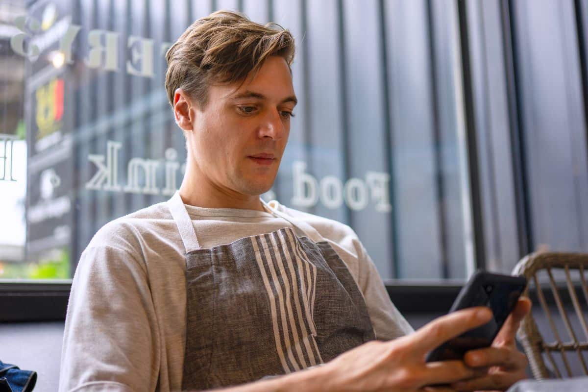Deskless Employee Using Device to Access Training Material