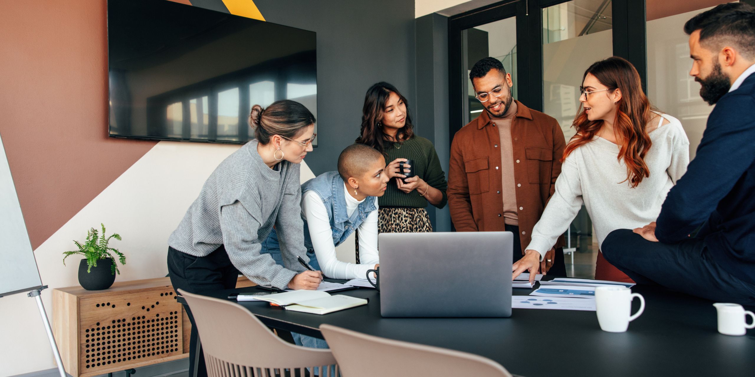 employees discussing enterprise lms