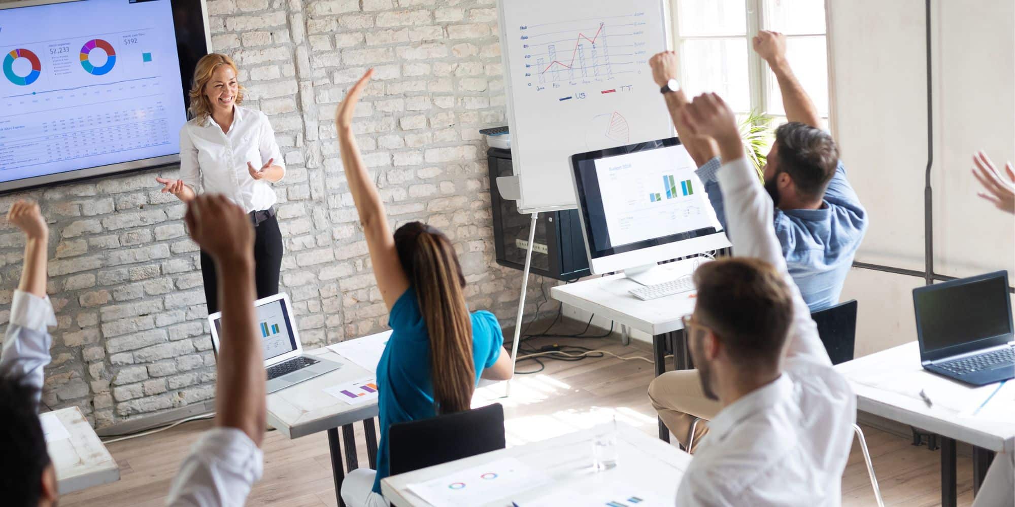 Employee training programs are presented by a trainer