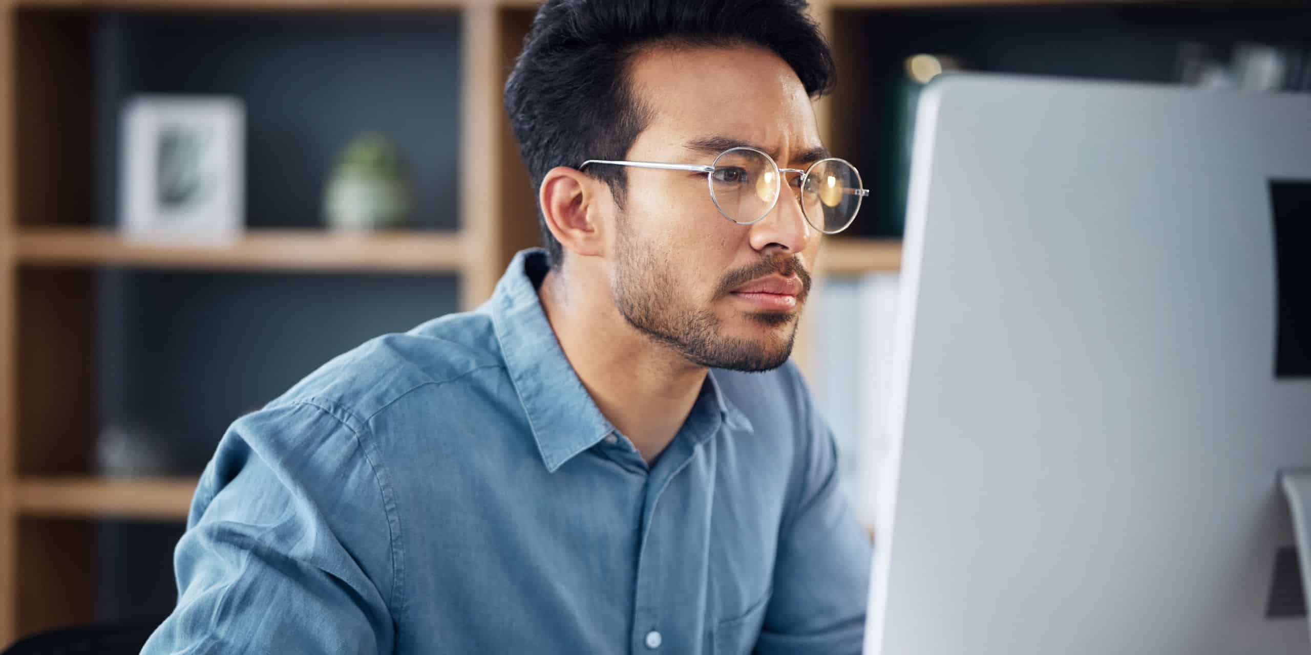 Employee Working on CPD Using Skills Matrix Guide