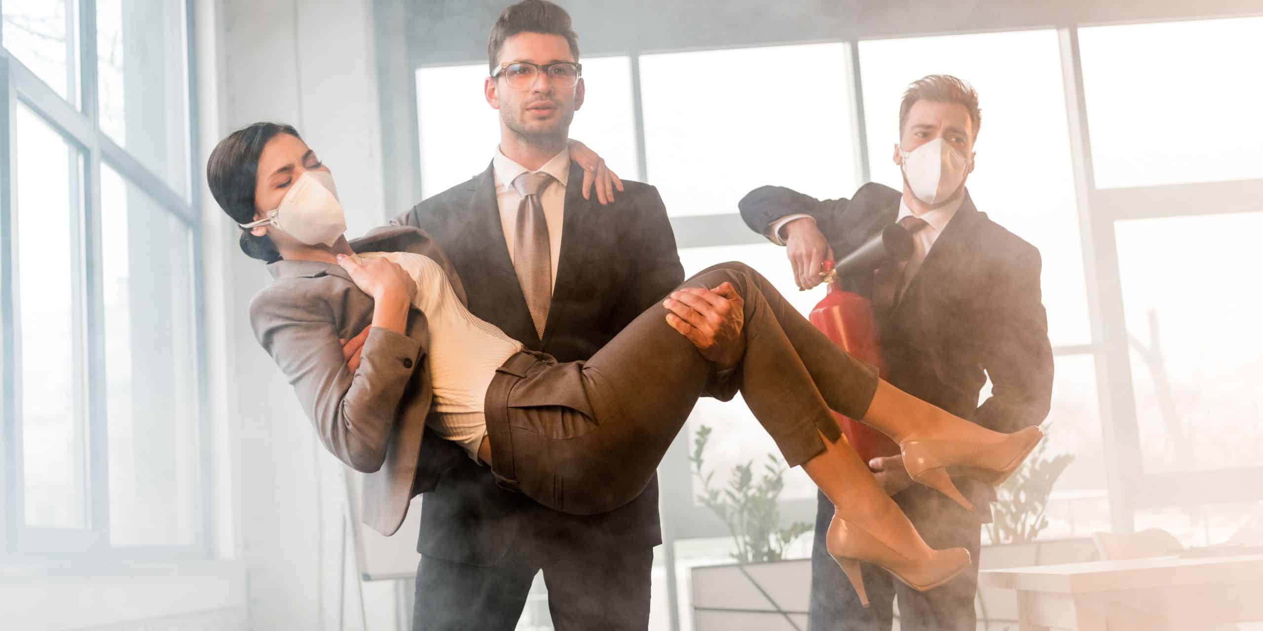 employees demonstrating emergency evacuation procedure during training