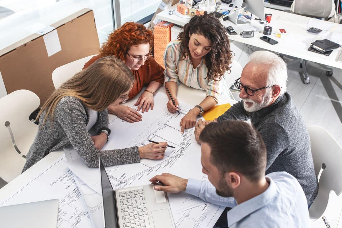 Employees Working Together Towards Team Building