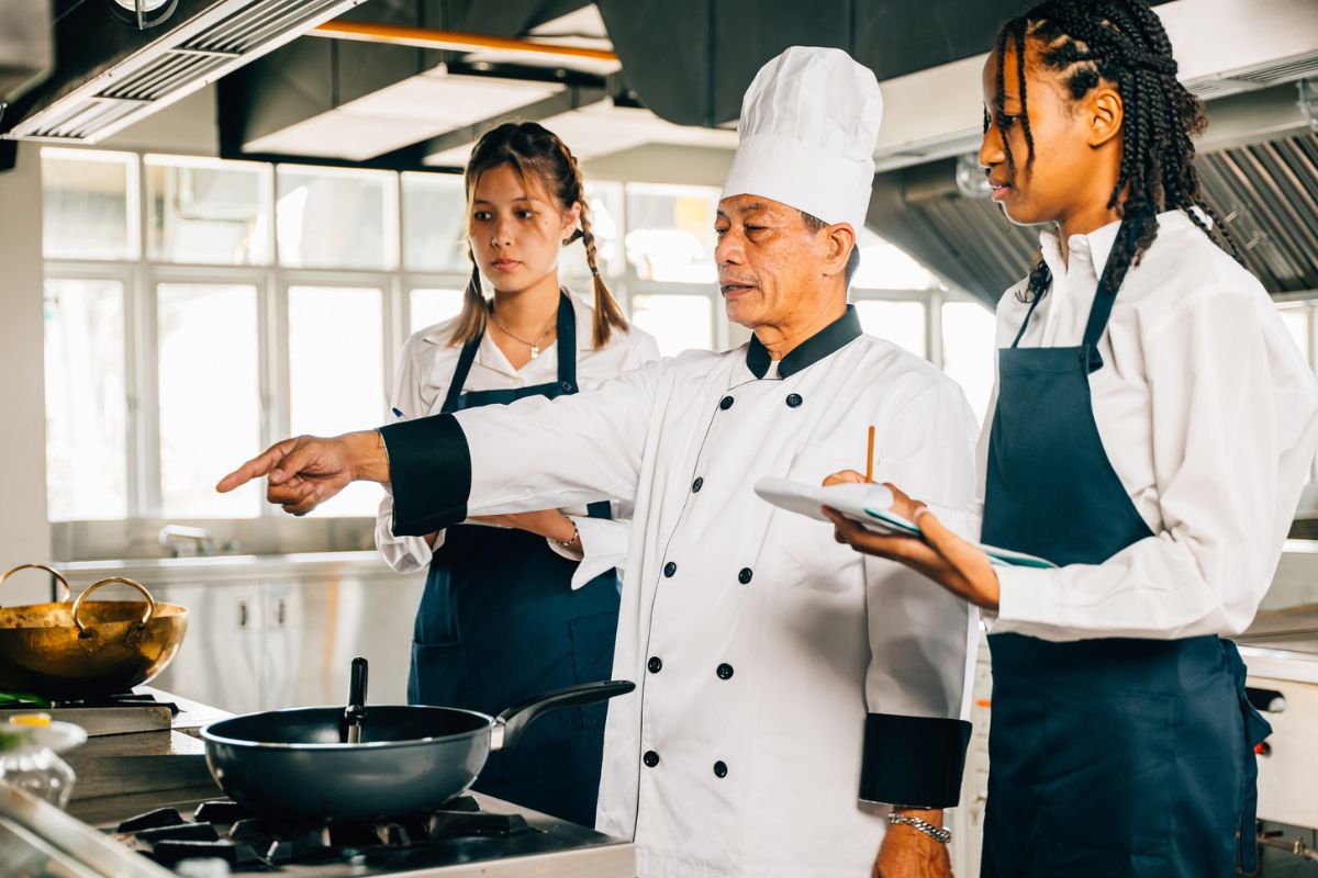 Hospitality learners engaged in a hands on training exercise