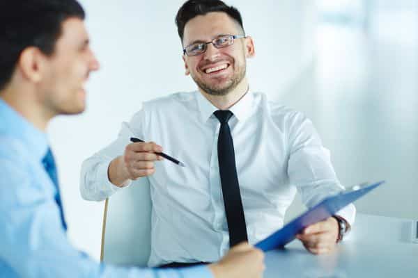 Manager sitting with surbordinate during performance review