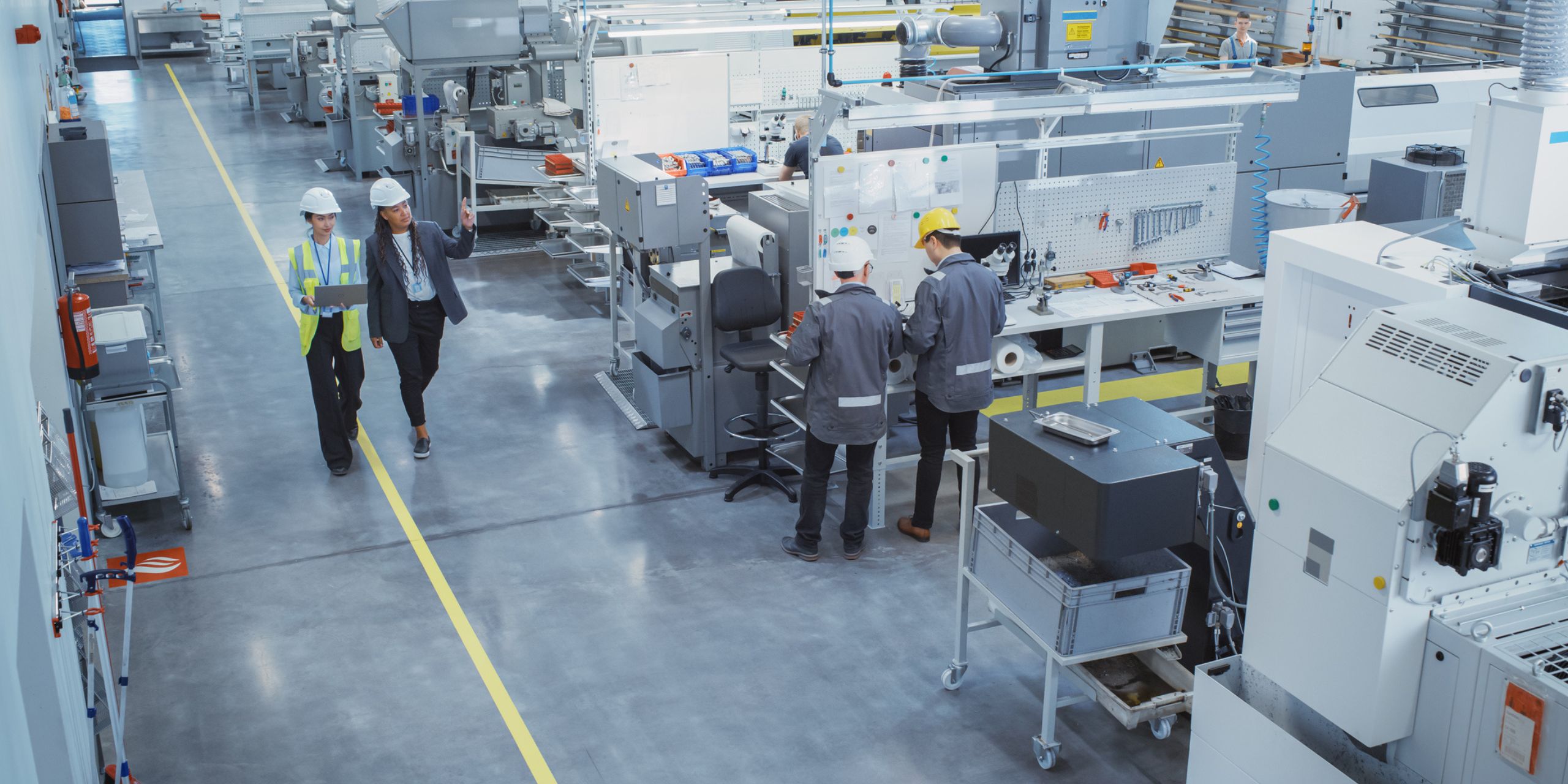 an example of manufacturing workers walking on the production floor