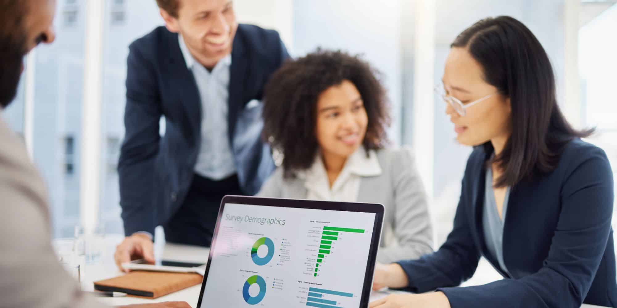 Team considers course creator software in a meeting