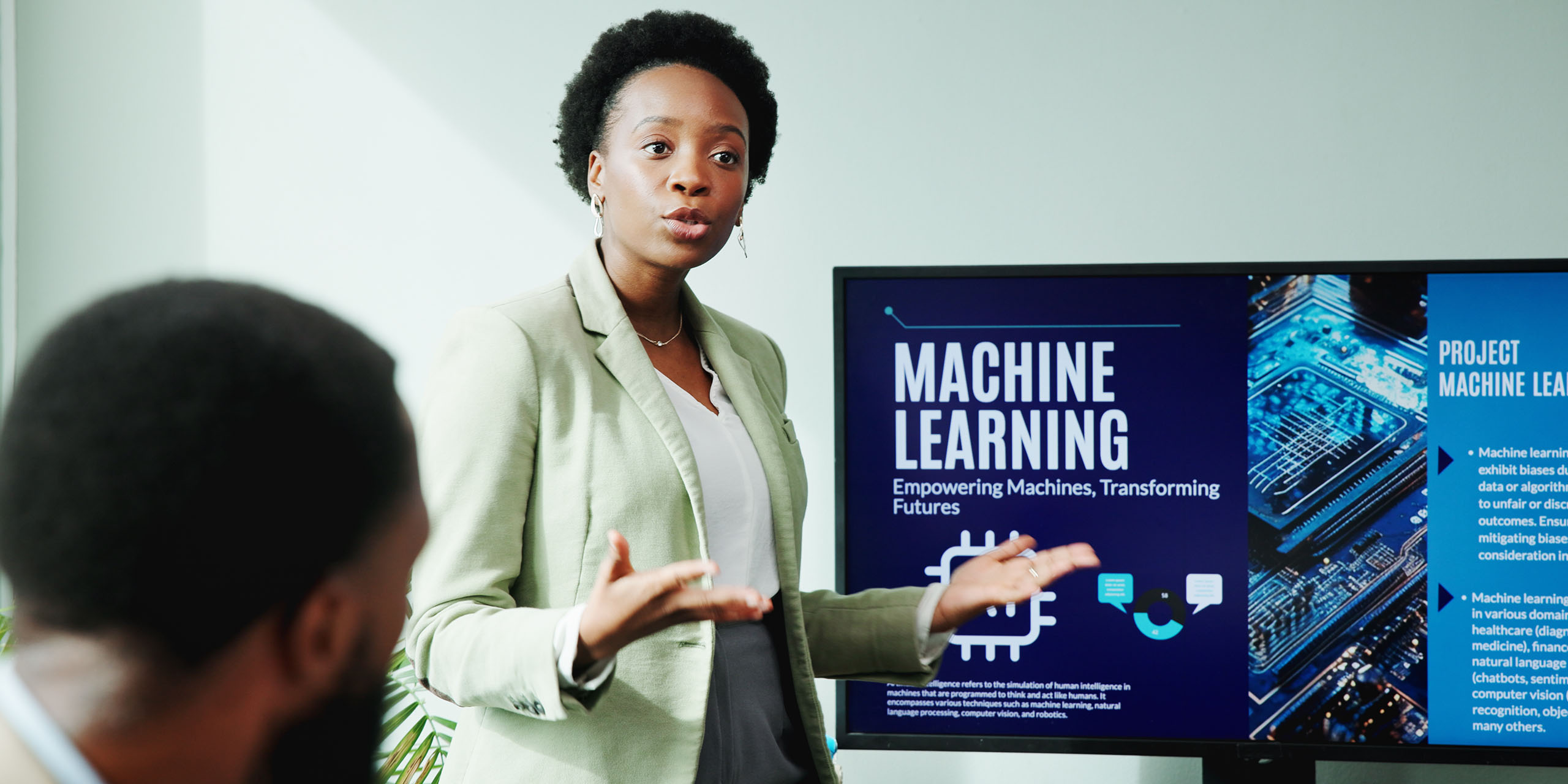 trainer presents lesson on machine learning in workplace
