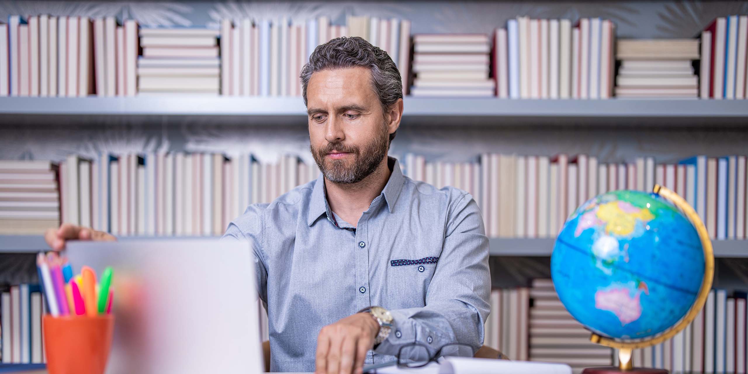 trainer using ai marking tool on laptop to grade assessments