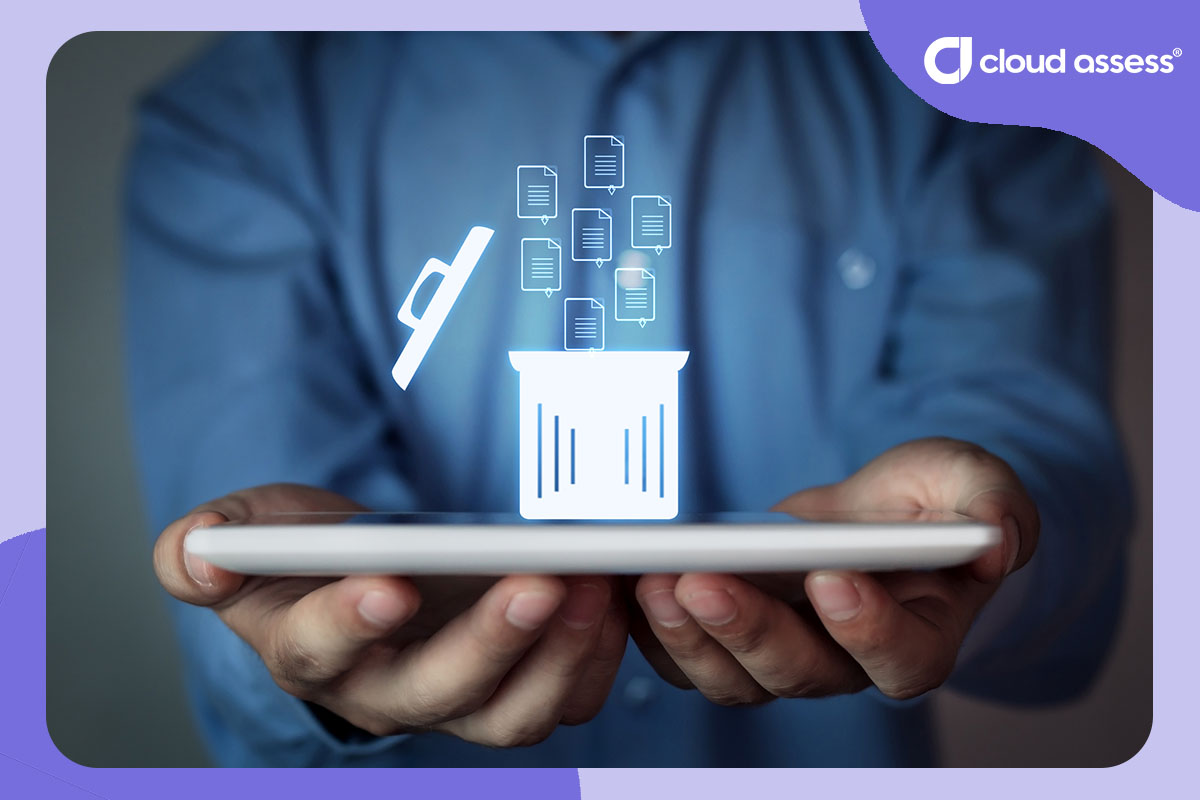 business man holds tablet with trash icon overlay