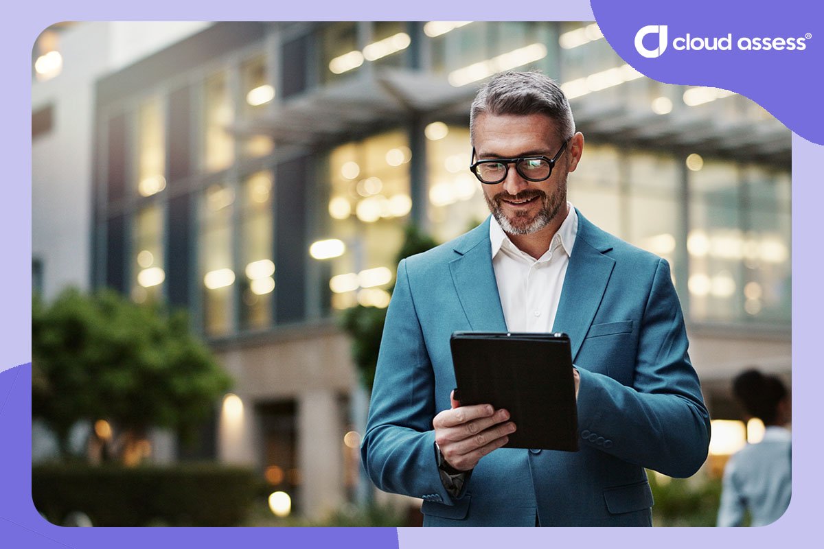 business man uses tablet to find information as part of self directed learning