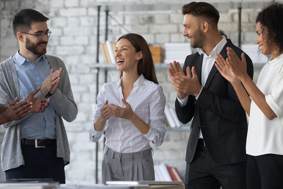business woman is recognised by colleagues showing how training can make employees feel valued