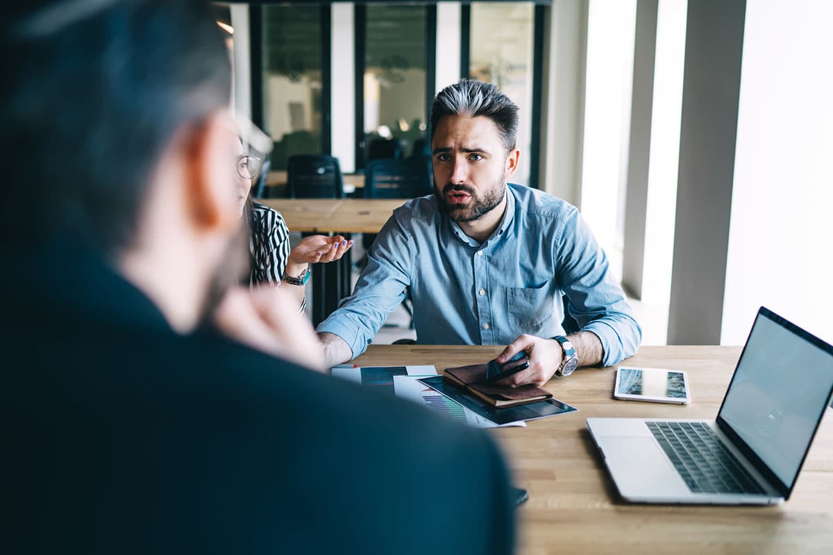 businessman with aggressive expression uses confronting conflict management style