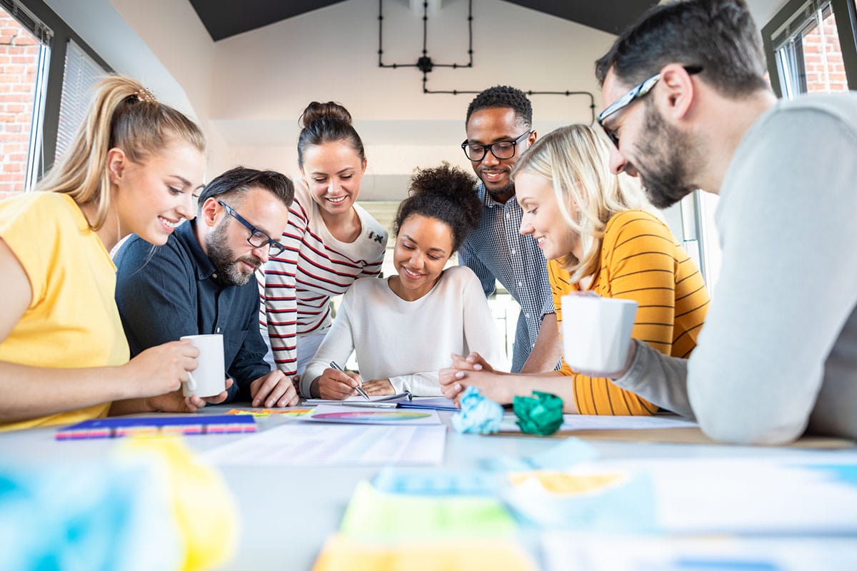 diverse team of employees work together showing a culture of learning