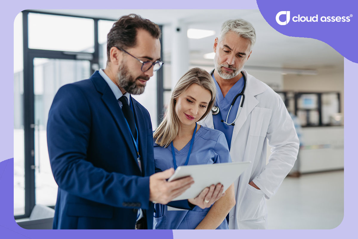 Doctor, nurse and administrator looking at a skills matrix from a tablet