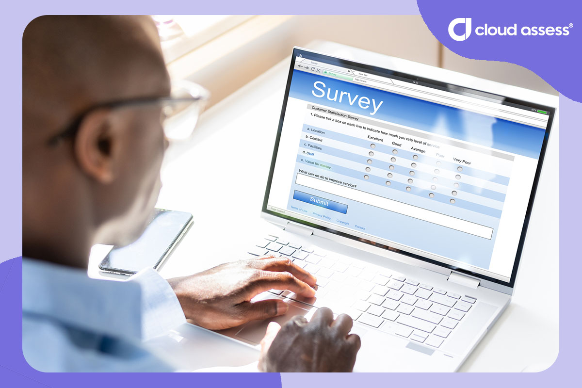 employee fills in online survey on laptop