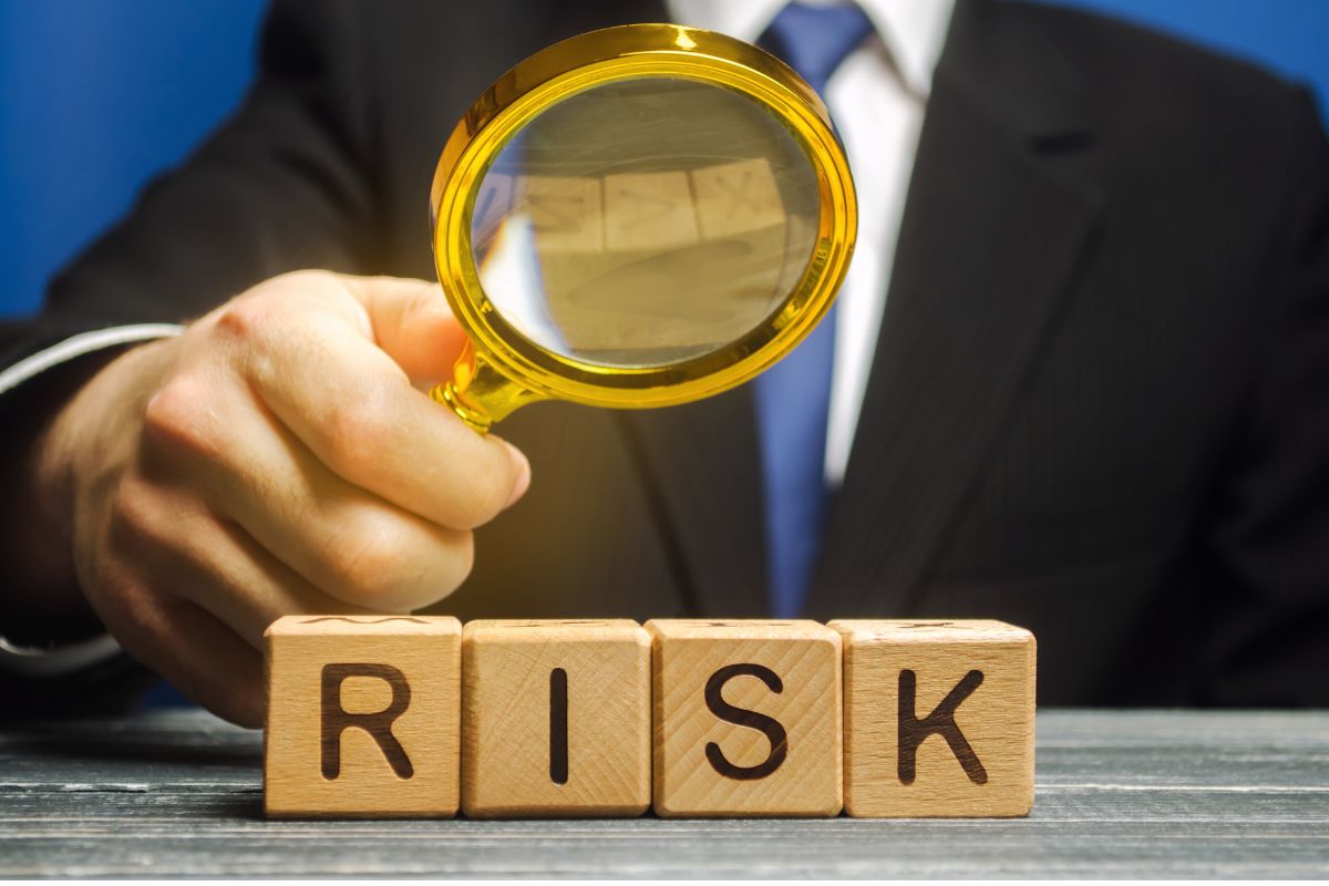 magnifying glass evaluating risk