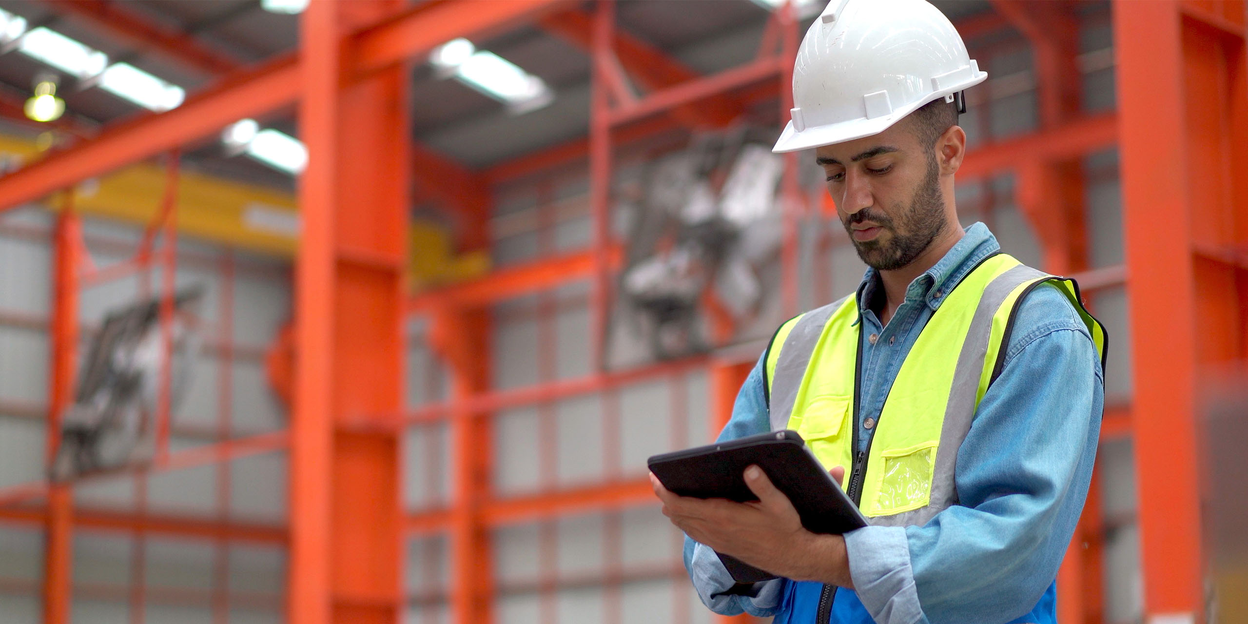work site manager checks compliance training status on tablet