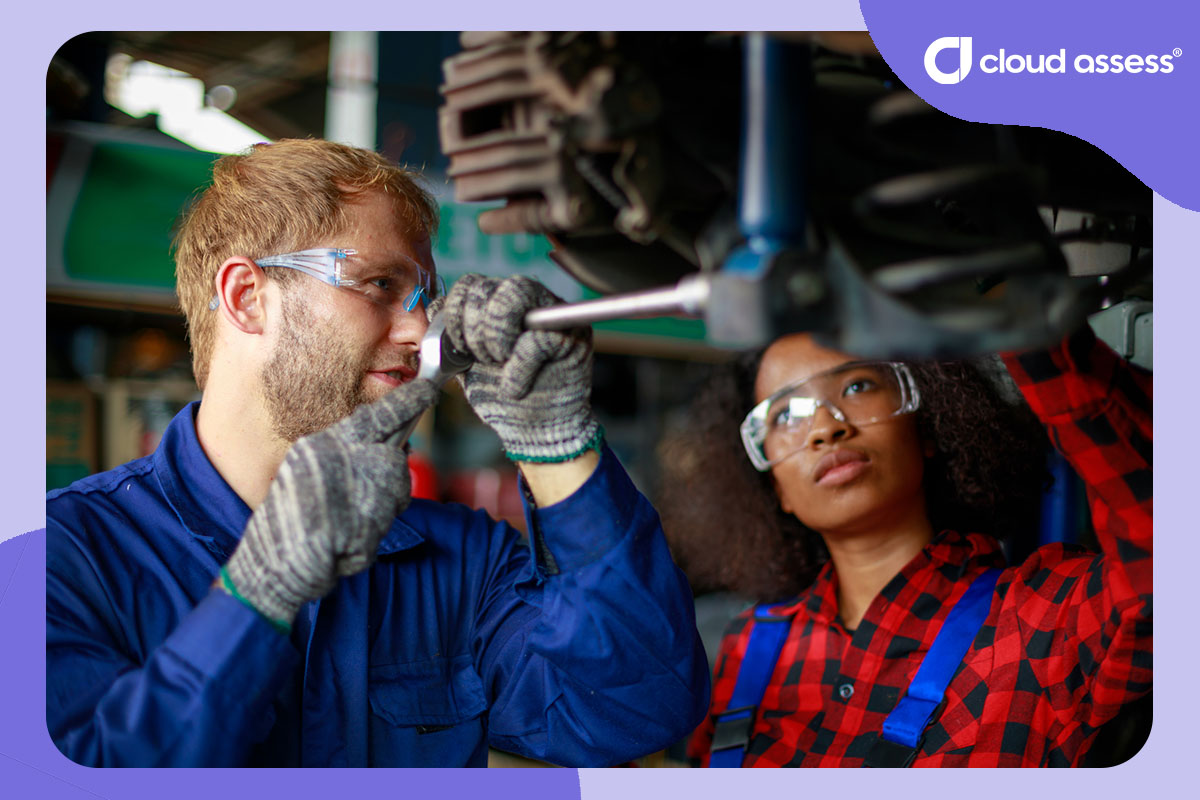 mechanic student and teacher work on car together as part of situated learning