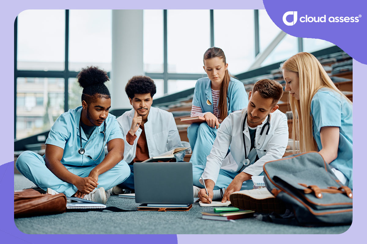 medical students sit on floor in classroom working together on problem