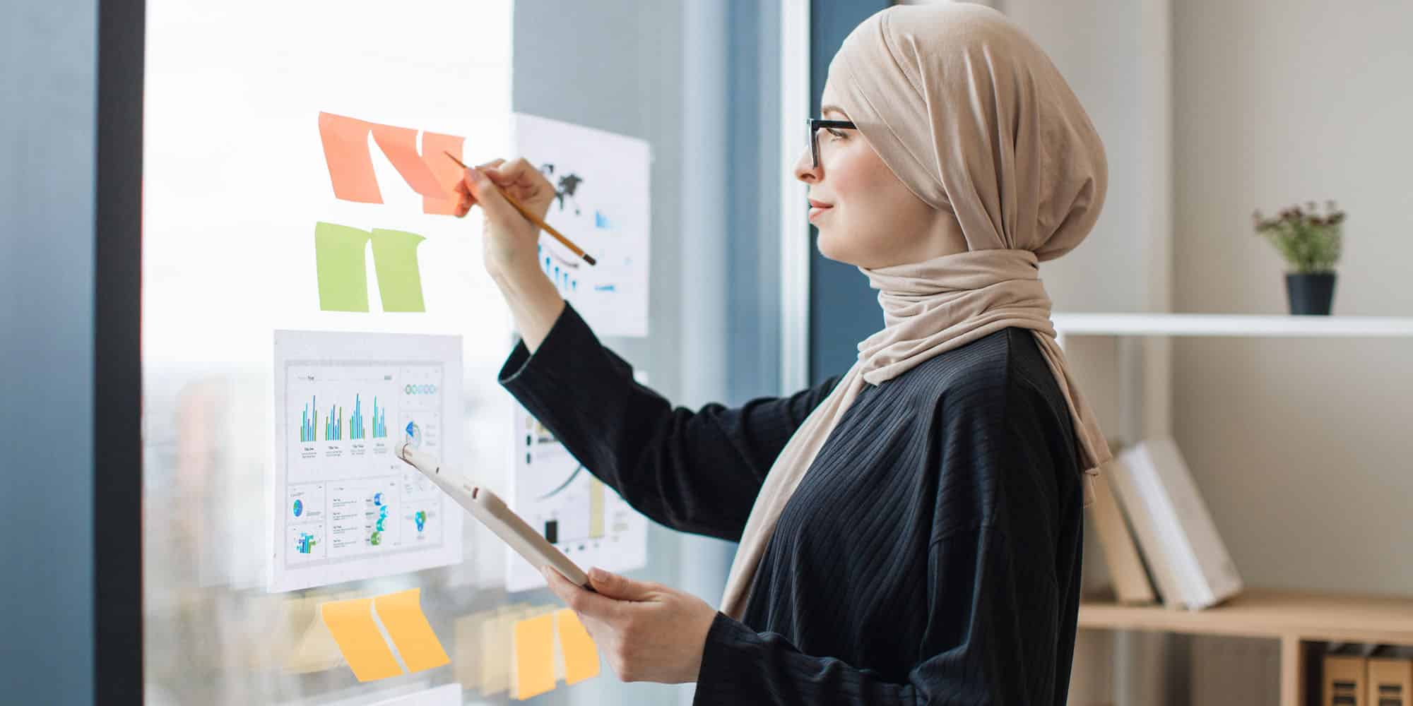 business woman tracks skills manually instead of using skills matrix software