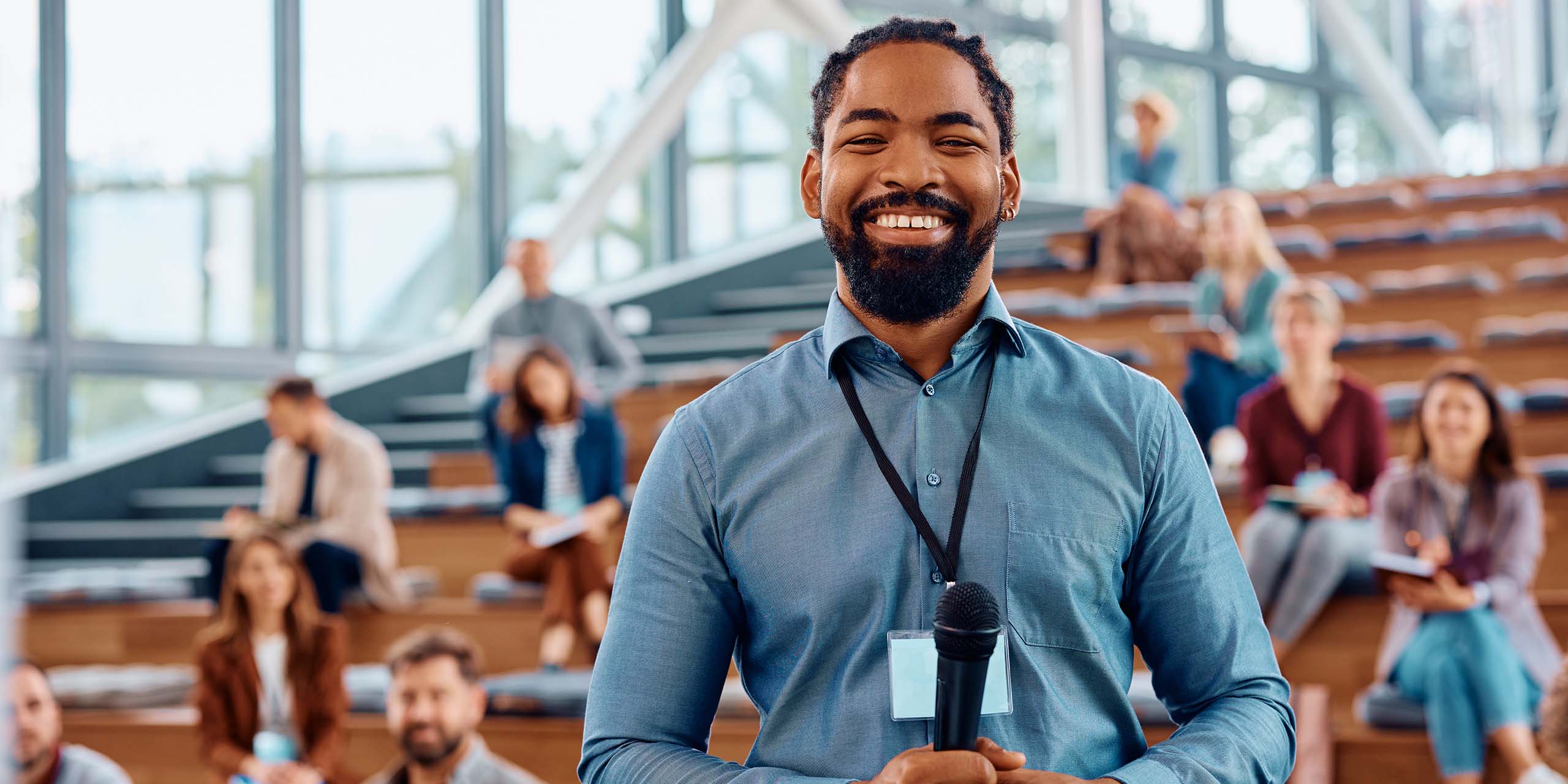 trainer stands in front of vet class in lecture venue