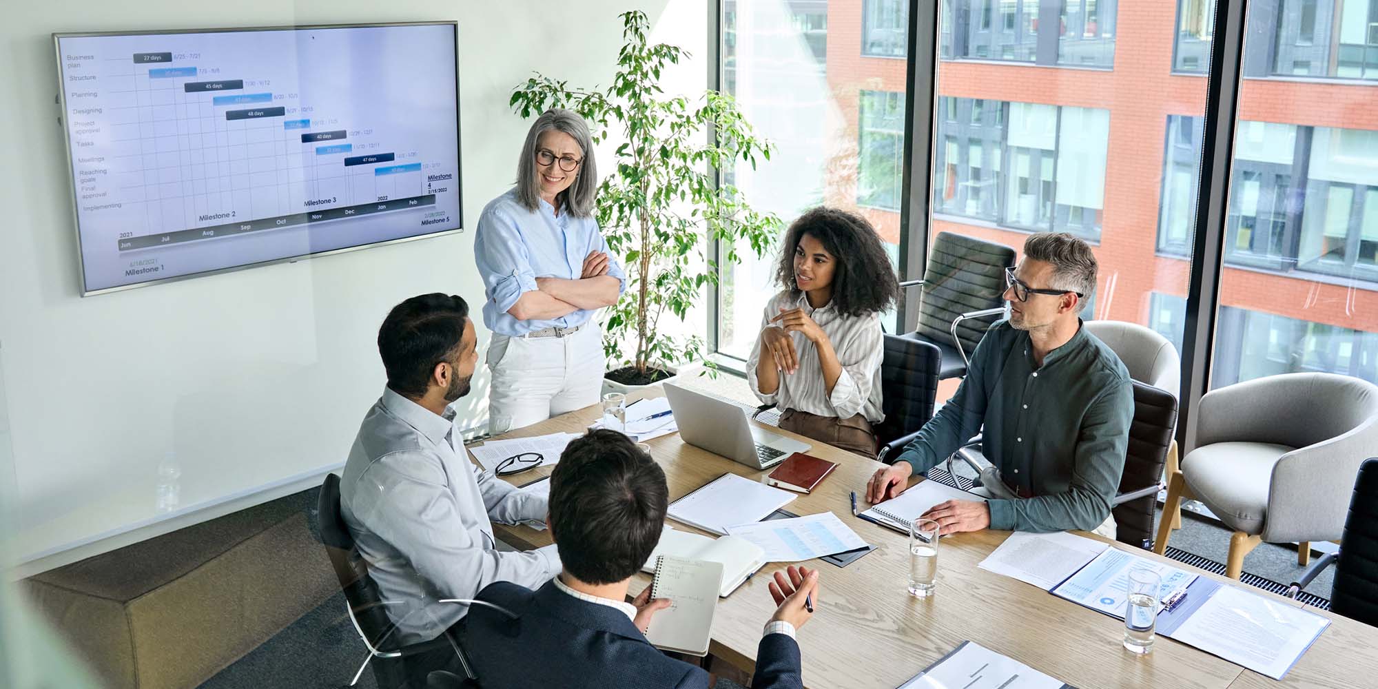 business holds formal meeting for training evaluation with multiple stakeholders