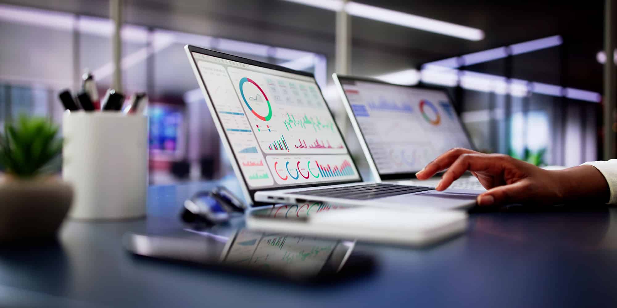 business person looks at visual training statistics using training matrix software