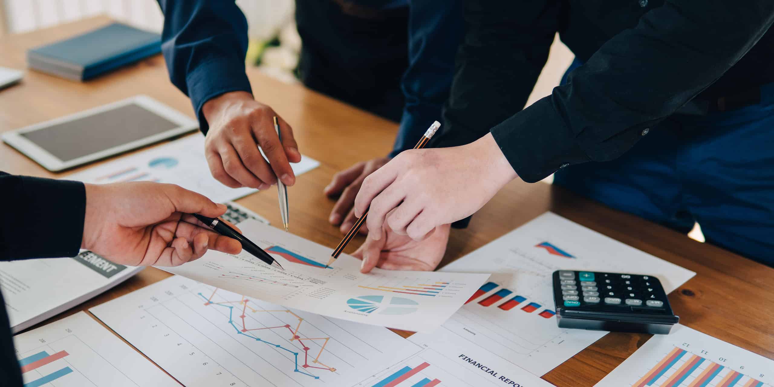business leaders look at training metrics during meeting