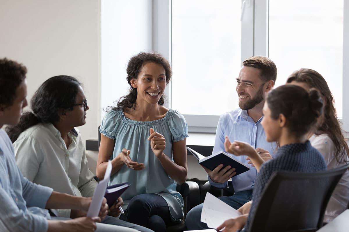 woman conducts group session as part of gathering training feedback