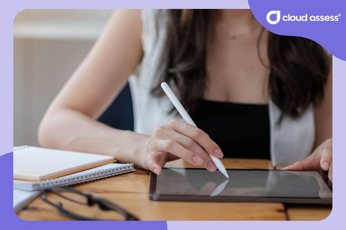 woman interacts with training material using tablet and stylus