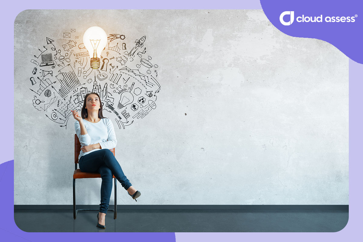 woman sitting on chair with illustration on wall behind her showing how an idea is attached to understanding of other concepts