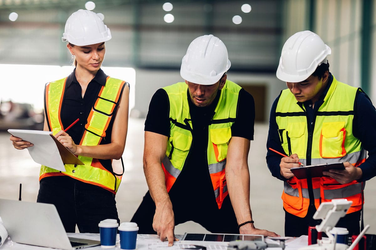 woman uses an onboarding checklist to check new employees work